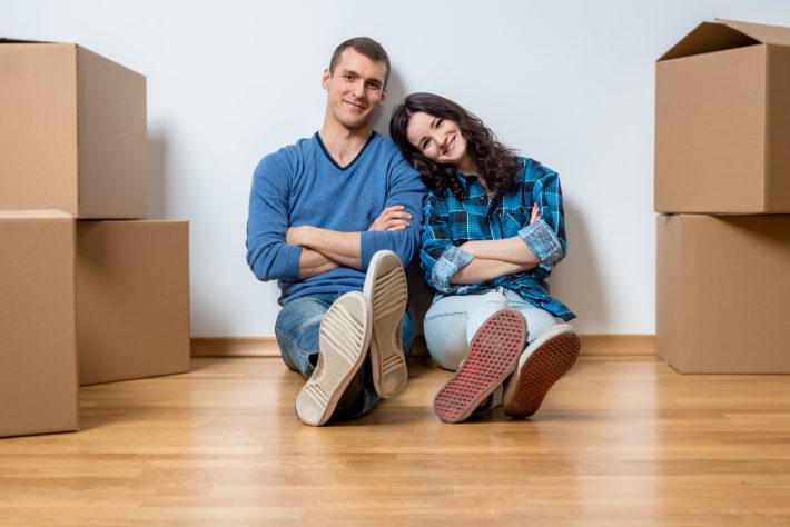 Two young couple during moving in